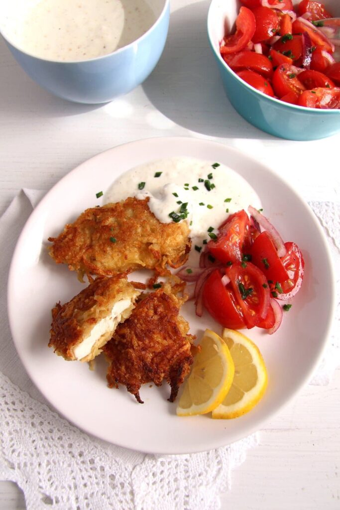 schnitzel potatoes 683x1024 Chicken Schnitzel with Potato Parmesan Crust, Yogurt Dip and Tomato Salad
